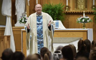 Fr. John giving a homily during mass.